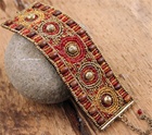 Matisse Beaded Bracelet  Elaborately beaded in hues of deep reds and golds this bracelet A fusion of East and West, modern and traditional, classic and trendy